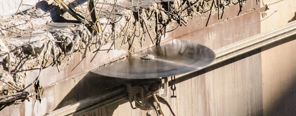 Diamond wall saw blade cutting through a reinforced concrete wall