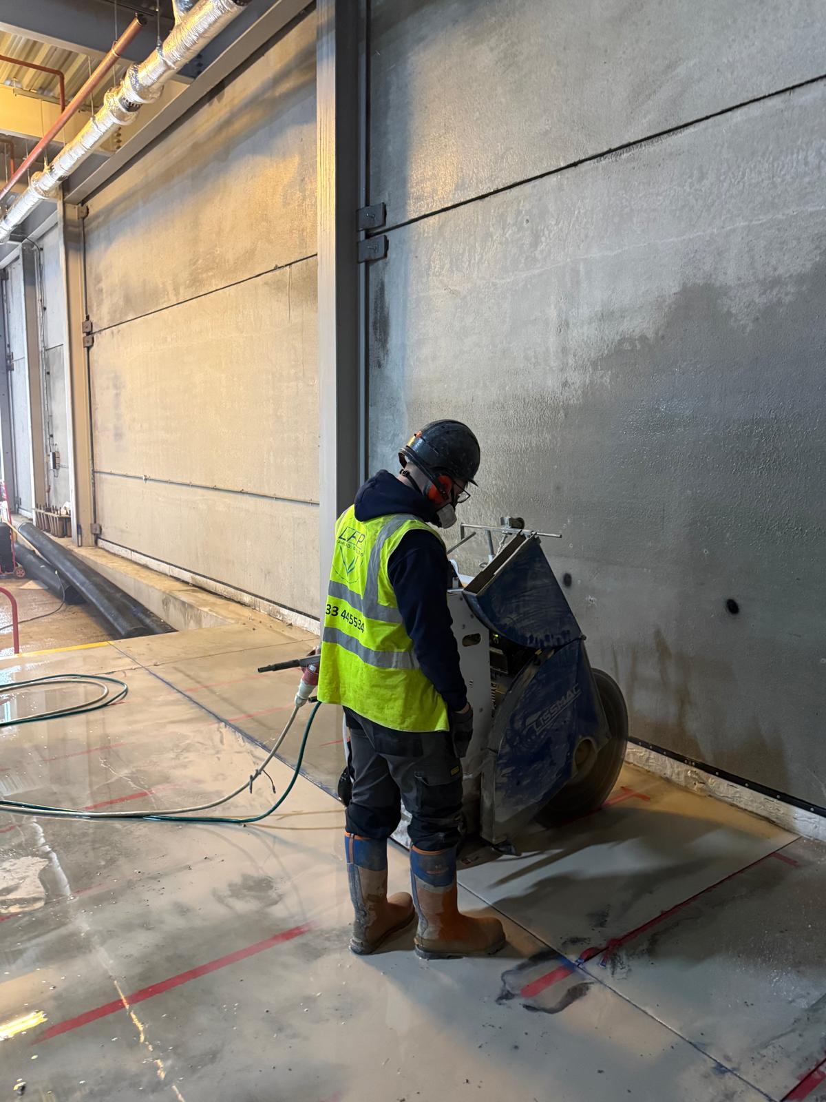 Liam Palmer saw cutting an opening on a commercial site